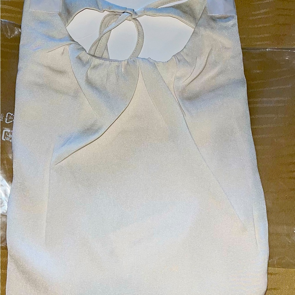 Cream colored Banana Republic tank top new in plastic with tag.